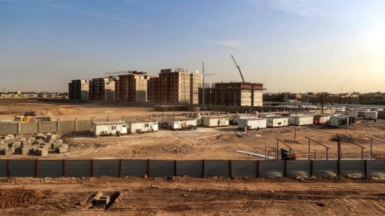 This picture taken on December 16, 2022 shows a view of unfinished apartment buildings at a housing complex in Iraq's capital Baghdad. - In oil-rich but corruption plagued Iraq, real estate has become a popular way to launder money, including stolen public funds. Compounded by housing planning failures and an increasing demand, it has pushed prices in the capital Baghdad rapidly out of reach for many ordinary Iraqis. Iraq's banking system remains underdeveloped: only one in five have bank accounts, according to the World Bank. (Photo by AHMAD AL-RUBAYE / AFP) (Photo by AHMAD AL-RUBAYE/AFP via Getty Images)