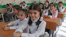 Pupils attend the first day of the new academic year in Arbil, the capital of northern Iraq's Kurdistan autonomous region, on September 13, 2022. (Photo by SAFIN HAMED / AFP)