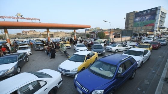 Iraqis queue at a petrol station to fill up with fuel amid shortages in southern city of Nasiriyah in the Dhi Qar province, on September 22, 2021. (Photo by Asaad NIAZI / AFP) (Photo by ASAAD NIAZI/AFP via Getty Images)